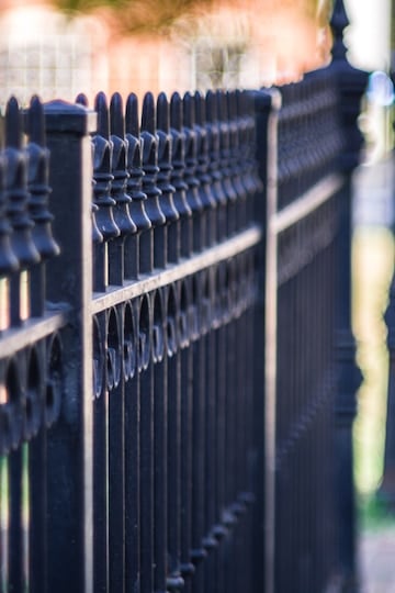 vertical closeup shot metal fence sidewalk 181624 40919